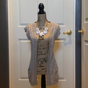 Sleeveless beige cardigan